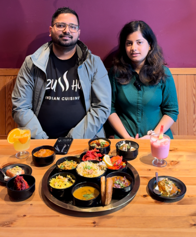 Zu sehen sind ein Mann und eine Frau, es sind Abdul Raoof Mohammed und Bushra Fatima von Zusshu Indian Cuisine